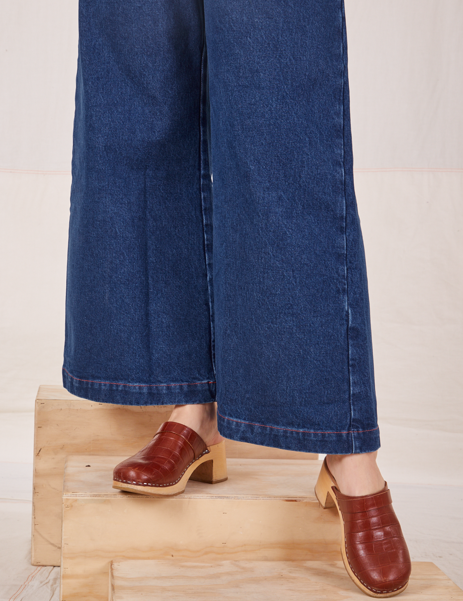 Indigo Wide Leg Trousers in Dark Wash pant leg close up on Alex