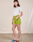 Side view of Classic Work Shorts in Gross Green and Burly Tee in Vintage Tee Off-White on Alex