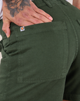 Classic Work Shorts in Swamp Green back pocket close up on Jesse