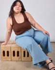 Ashley is wearing Cropped Tank Top in Fudgesicle Brown and light wash Indigo Wide Leg Trousers