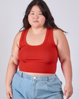 Ashley is 5'7" and wearing L Cropped Tank Top in Mustang Red
