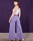 Angled back view of Overdyed Wide Leg Trousers in Faded Grape and Cropped Cami in vintage tee off-white