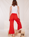 Back view of Bell Bottoms in Mustang Red and Cropped Tank Top in vintage tee off-white