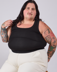 Sam is wearing Tank Top in Basic Black