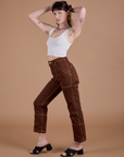 Angled front view of Carpenter Jeans in Fudgesicle Brown on Alex