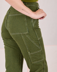 Railroad Carpenter Jeans in Summer Olive side close up on Alex