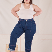 Ashley is 5'7" and wearing 1XL Carpenter Jeans in Dark Wash paired with our vintage off-white Tank Top