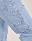 Close up of Carpenter Jeans in Light Wash pockets