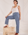 Tiara is wearing Carpenter Jeans in Railroad Stripes and Tank Top in vintage tee off-white