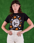 Alex is wearing Halloween Organic Tee in Moon tucked into vintage tee off-white Work Pants