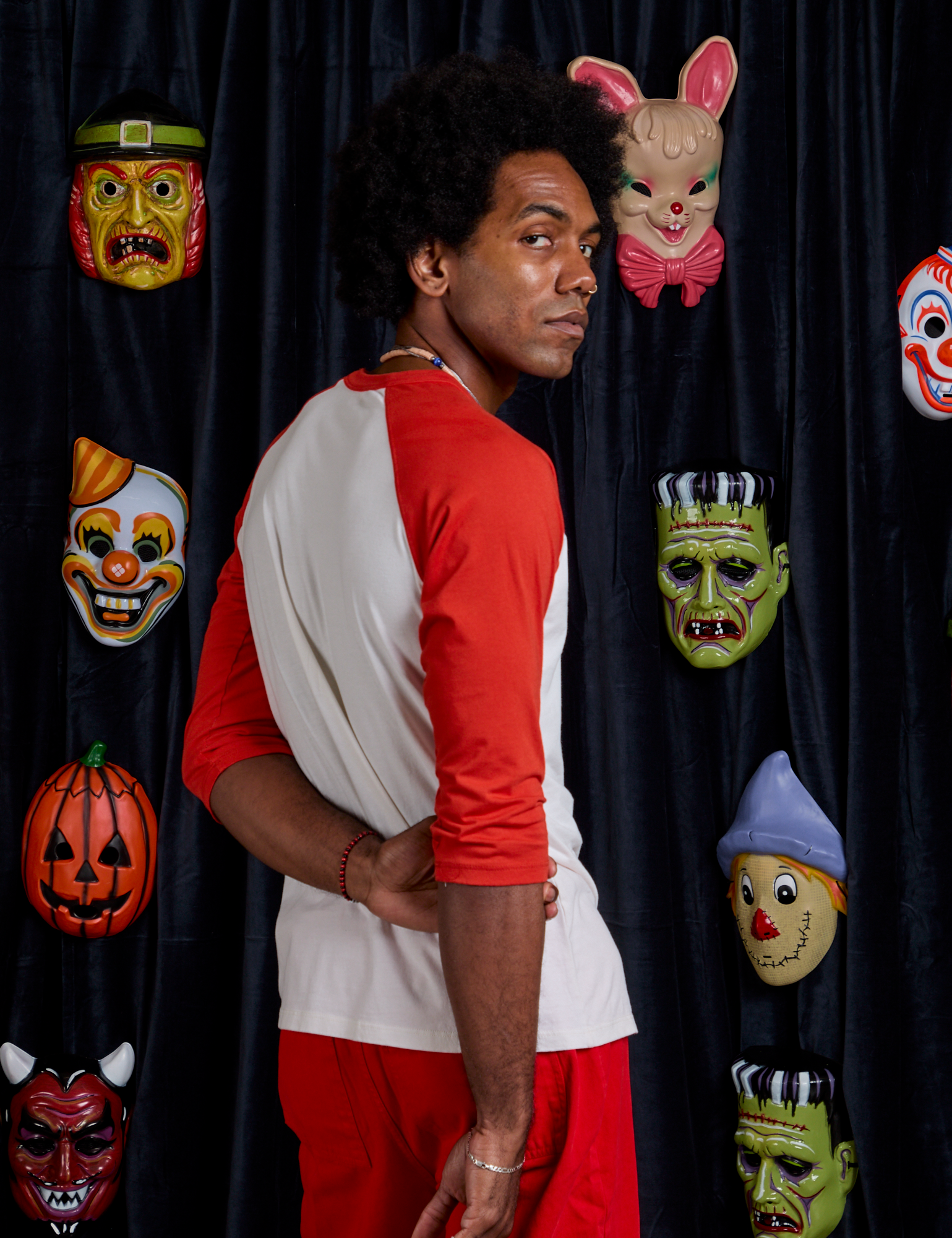 Angled back view of Raglan Tee in Dracula on Jerrod