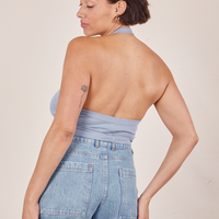 Back view of Halter Top in Periwinkle and light wash Sailor Jeans worn by Tiara