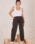 Tiara is 5'4" and wearing S Heavyweight Trousers in Espresso Brown paired with Cropped Tank Top in vintage tee off-white