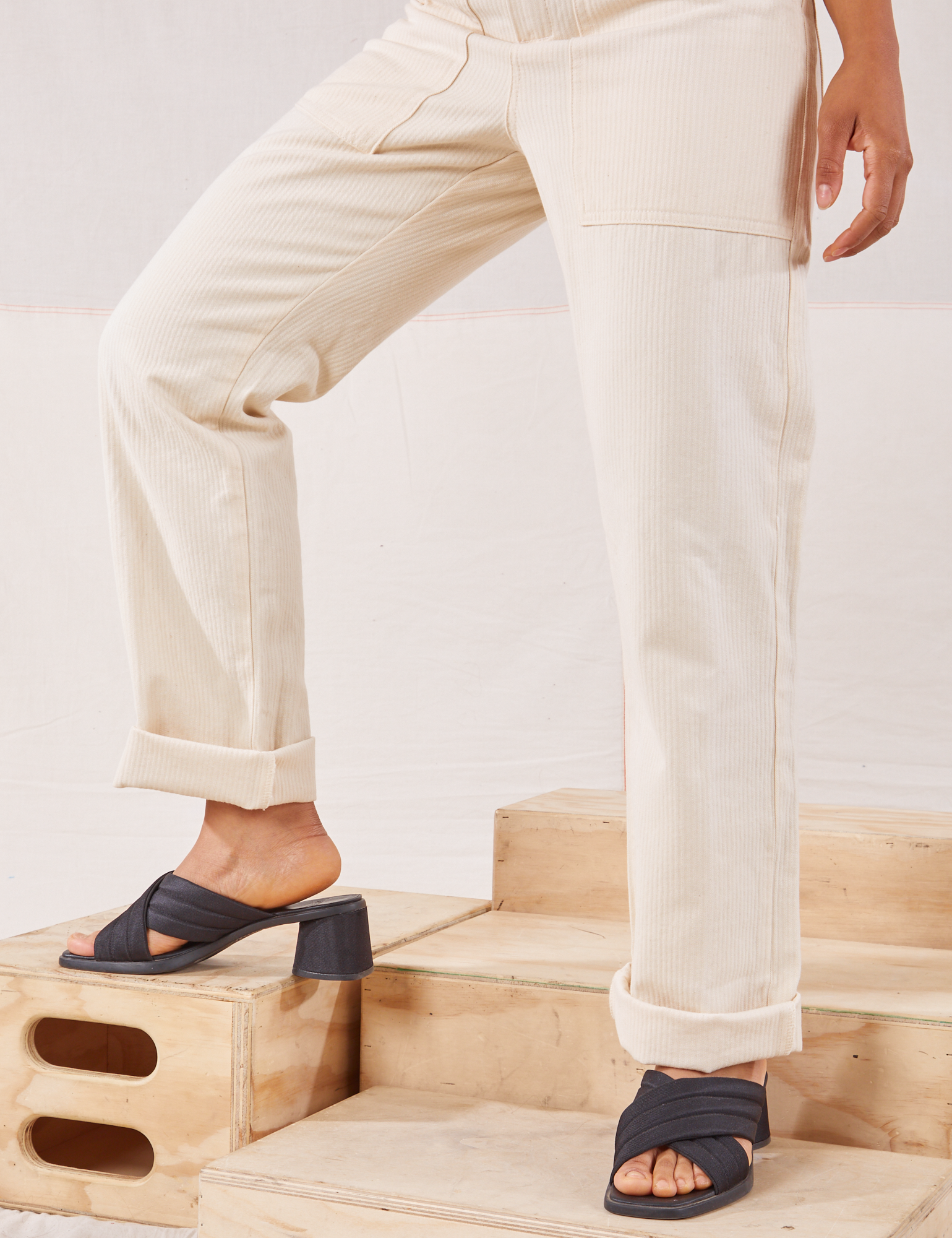 Heritage Short Sleeve Jumpsuit in Natural pant leg close up on Mika