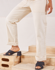 Heritage Short Sleeve Jumpsuit in Natural pant leg close up on Mika