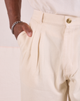 Heritage Trousers in Natural  front pocket close up on Issac.