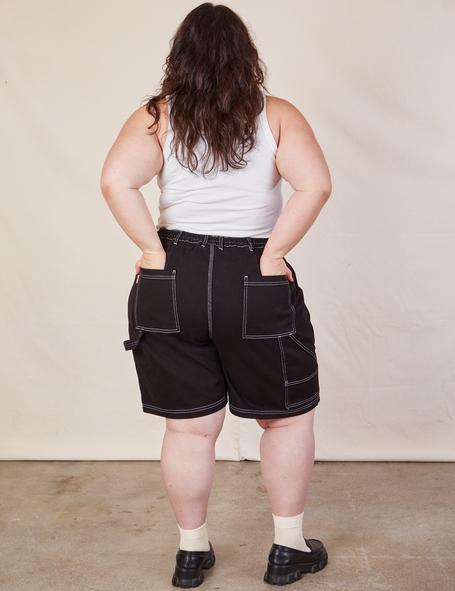 Back view of Carpenter Shorts in Basic Black and Cropped Tank in vintage tee off-white on Ashley
