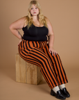 Black Stripe Work Pants in Construction Orange and black cropped tank on Juliet