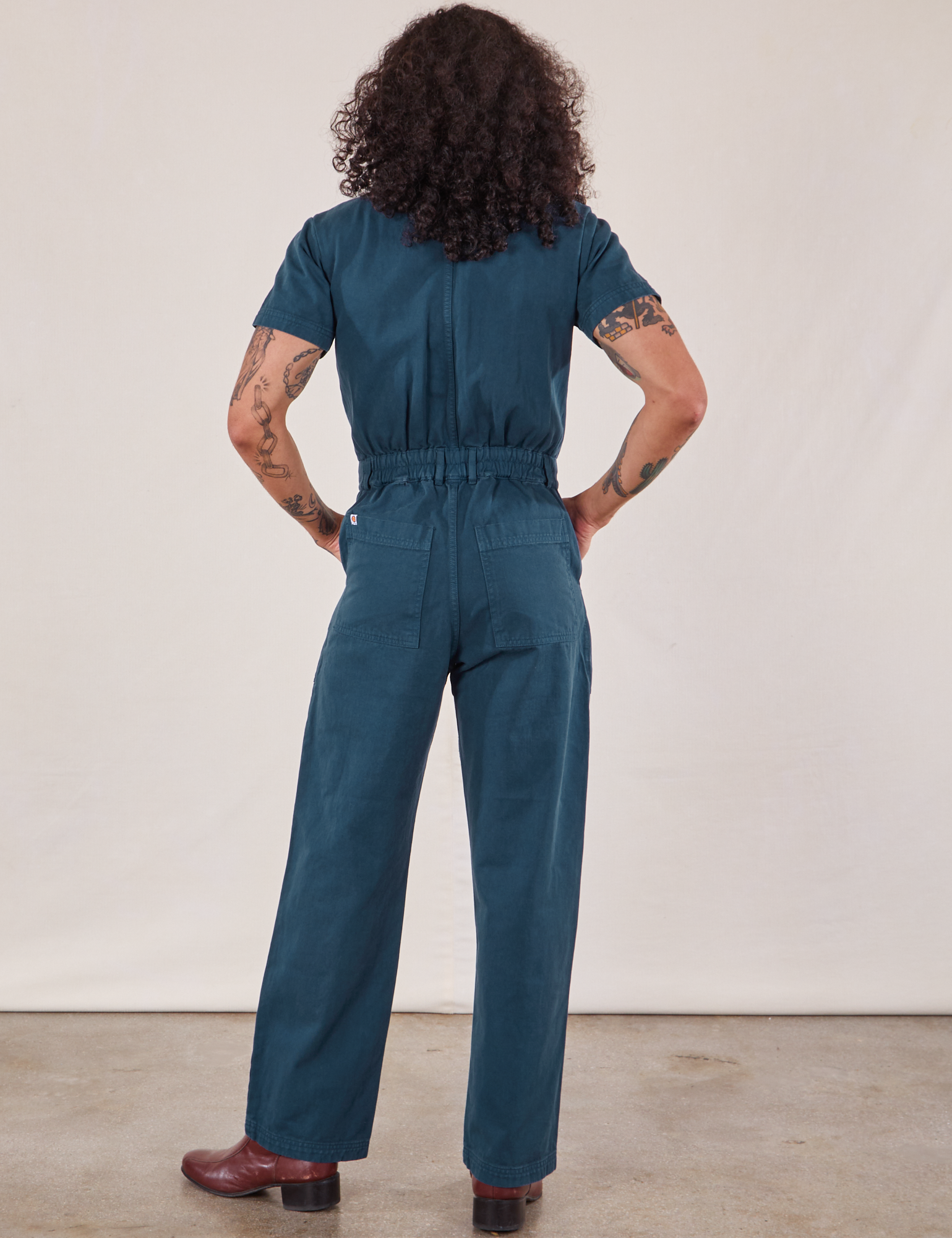 Short Sleeve Jumpsuit in Lagoon back view on Jesse