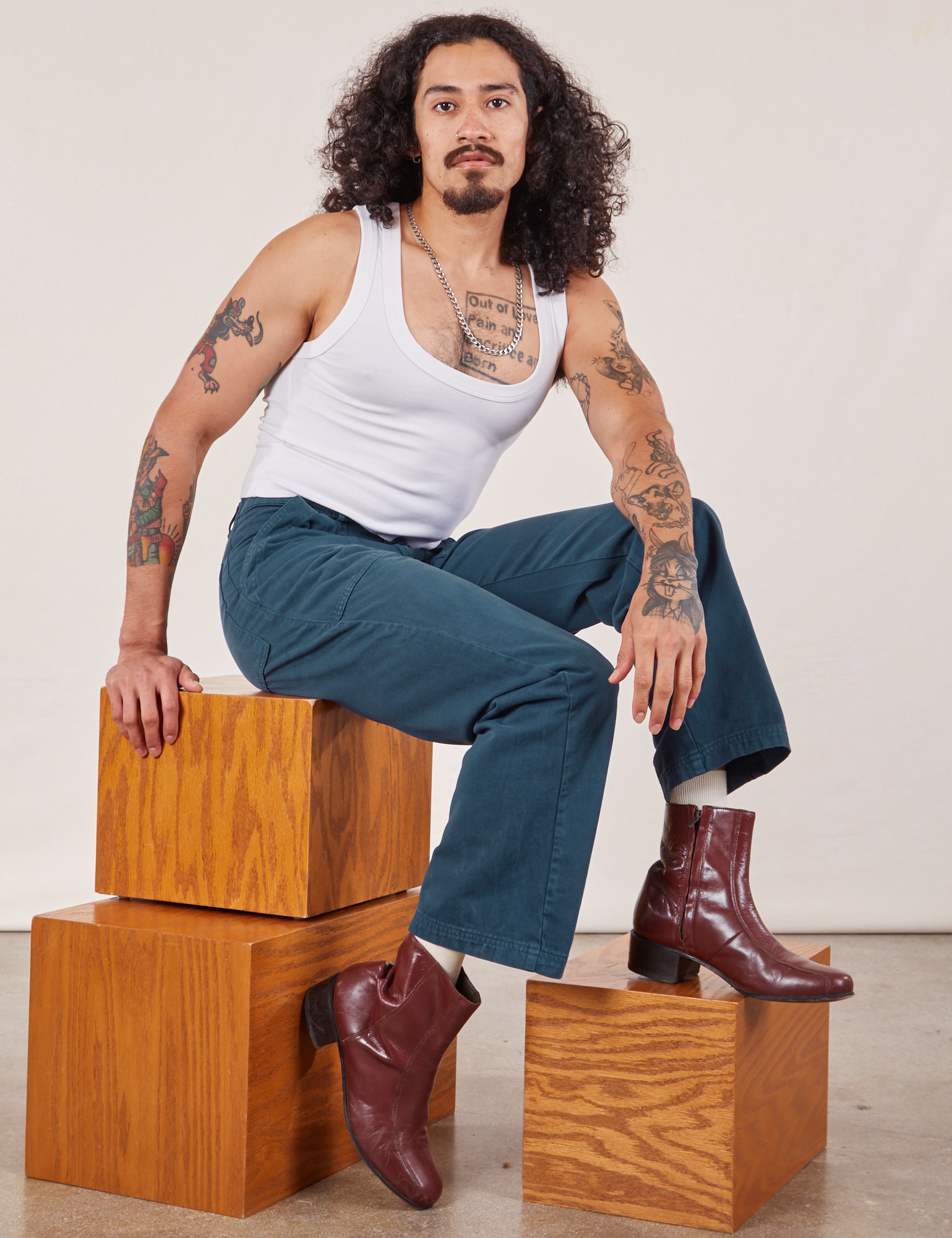 Jesse is wearing Work Pants in Lagoon and vintage tee off-white Cropped Tank