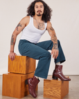 Jesse is wearing Work Pants in Lagoon and vintage tee off-white Cropped Tank
