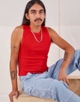 Anthony is wearing Muscle Tee in Mustang Red