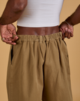 Baggy Mid-Rise Trousers in Desert Brown back close up on Jerrod