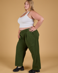 Baggy Mid-Rise Trousers in Evergreen side view on Juliet