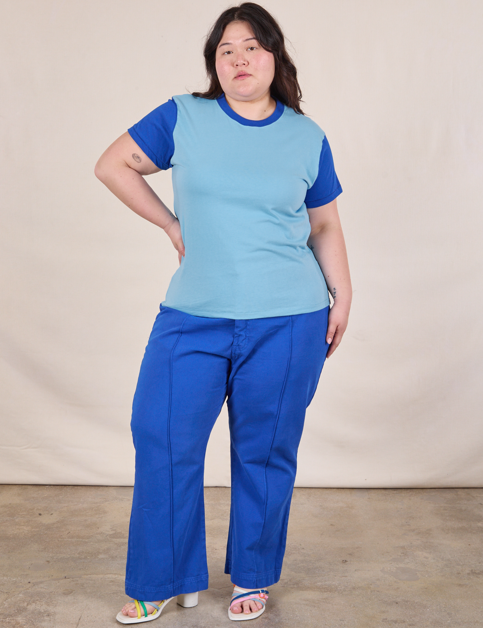 Ashley is wearing Mismatched Tee in Baby & Royal Blue and royal blue Western Pants