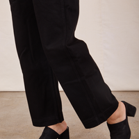 Side view pant leg close up of Original Overalls in Mono Black worn by Tiara.