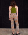 Back view of Work Pants in Autumn Stripe and summer olive Racerback Tank on Alex