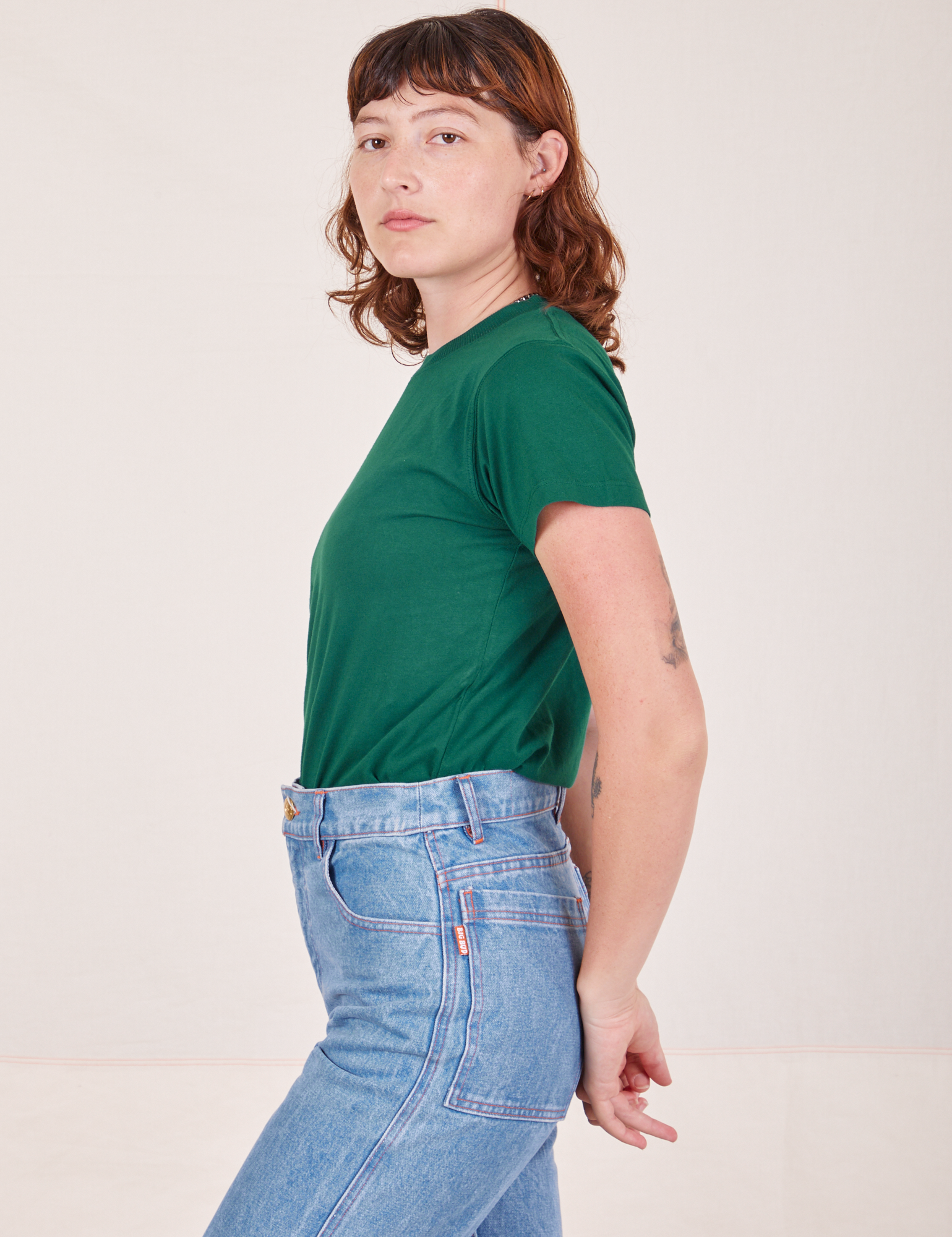 Side view of Organic Vintage Tee in Hunter Green on Alex