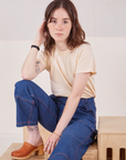 Hana is wearing Organic Vintage Tee in Vintage Tee Off-White and dark wash Carpenter Jeans