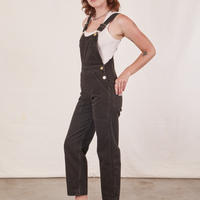 Side view of Original Overalls in Mono Espresso and vintage off-white Cropped Tank Top worn by Alex.