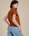 Angled back view of Pantry Button-Up in Burnt Terracotta on Alex