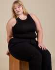 Racerback Tank in Black and Work Pants in Black worn by Juliet