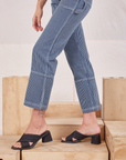 Carpenter Jeans in Indigo Railroad pant leg side close up on Alex