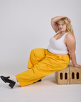 Drop Pocket Cargo Pants in Sunshine Yellow and Cropped Tank in Vintage Tee White on Juliet