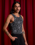 Angled front view of Spider Webs Racerback Tank on Anthony
