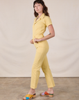 Short Sleeve Jumpsuit in Butter Yellow side view on Alex