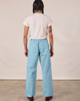Back view of Work Pants in Baby Blue and Organic Vintage Tee in Vintage Tee Off-White on Anthony