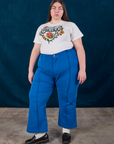 Chicago Tourist Tee and royal blue Western Pants worn by Marielena