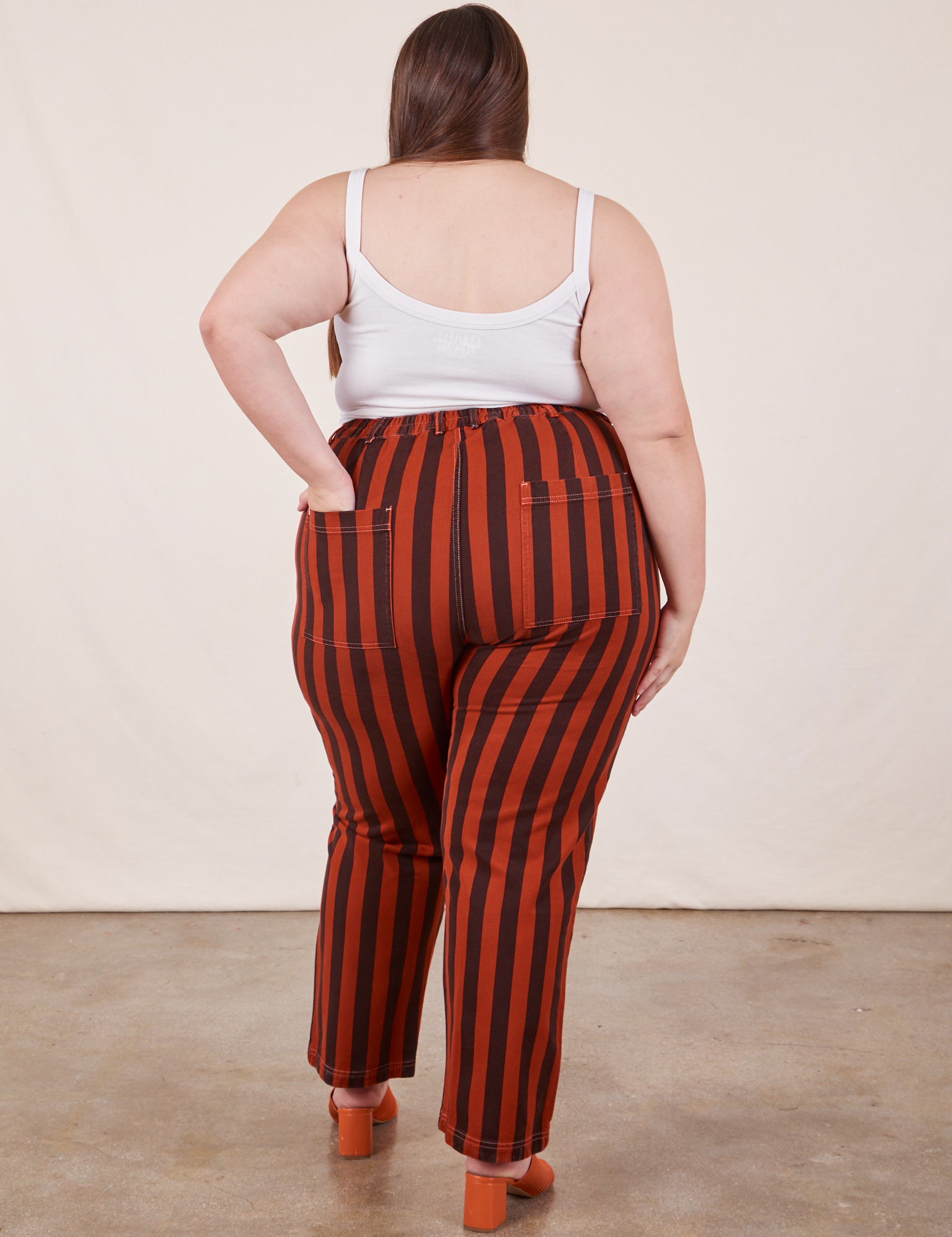 Back view of Black Striped Work Pants in Paprika and vintage off-white Cropped Cami on Marielena