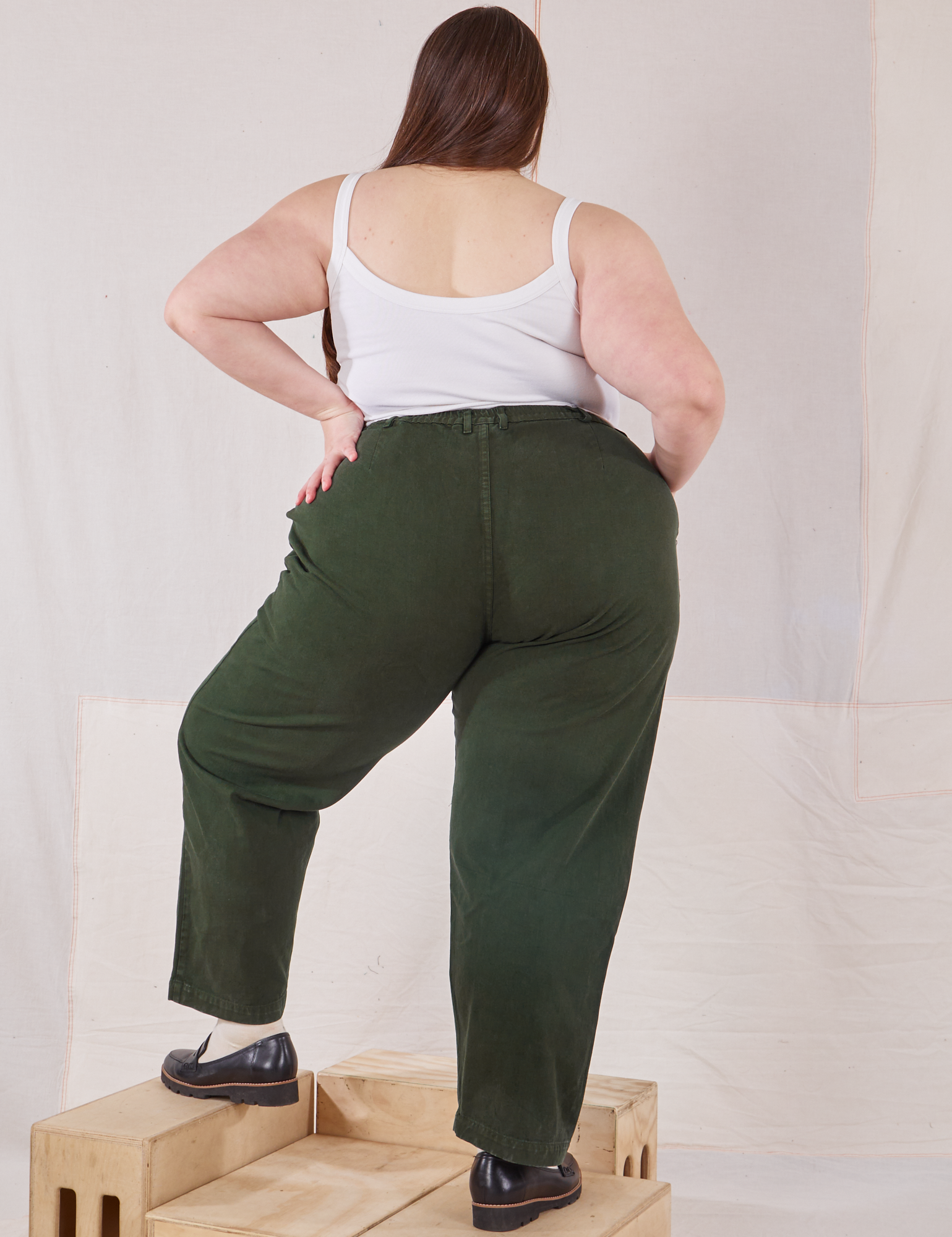 Back view of Heavyweight Trousers in Swamp Green and vintage tee off-white Cami on Marielena