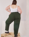 Back view of Heavyweight Trousers in Swamp Green and Cropped Cami in vintage tee off-white on Marielena