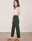 Side view of Petite Work Pants in Swamp Green and Cropped Tank Top in vintage tee off-white on Hana