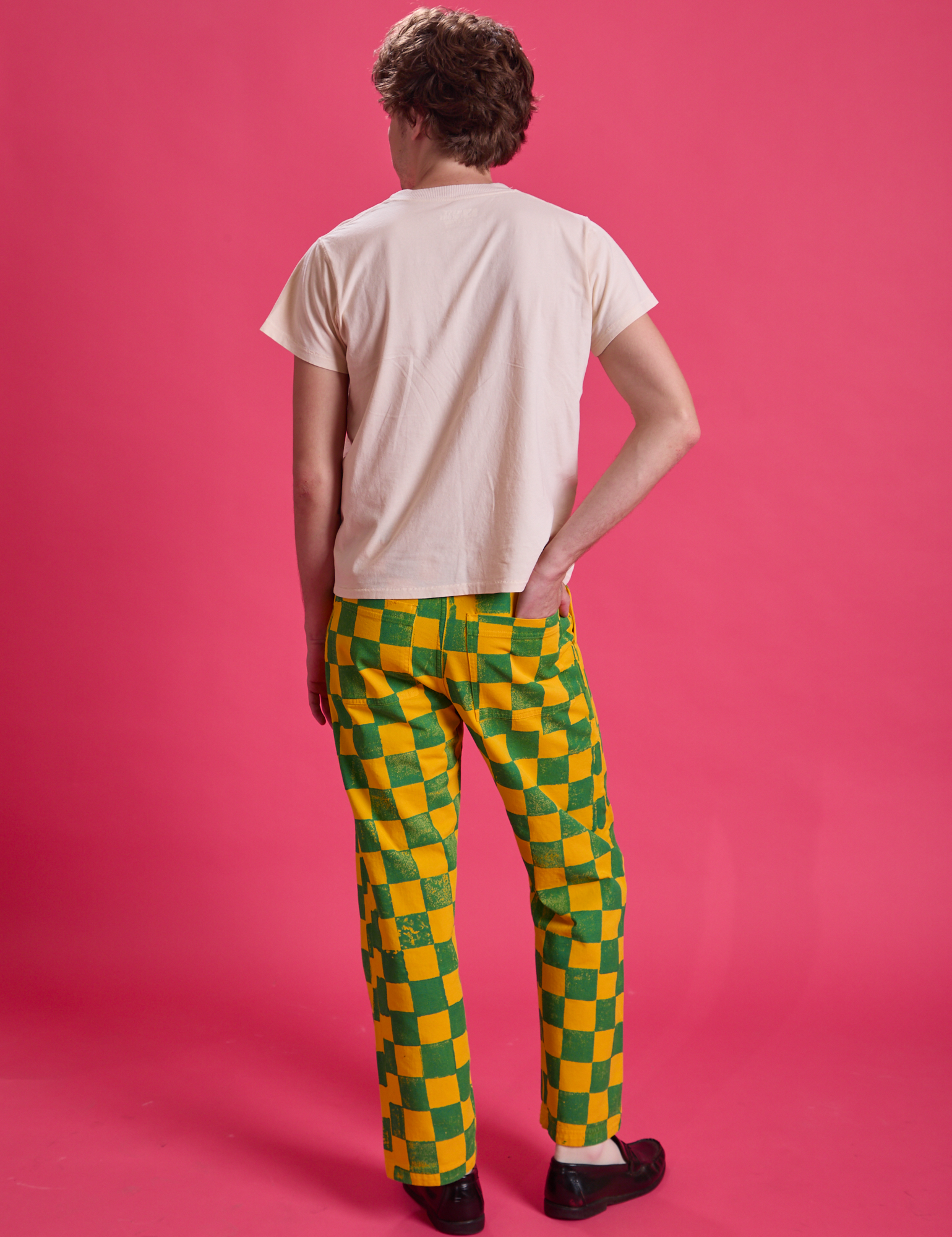 Back view of Checkerboard Work Pants in Green/Yellow and Organic Vintage Tee in vintage off-white