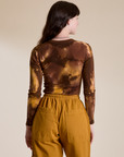 Long Sleeve Baby Tee in Honey Brown back view on Alex