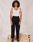Jesse is 5'8" and wearing XXS Denim Trouser Jeans in Black paired with Tank Top in vintage tee off-white