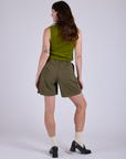 Pleated Trouser Shorts in Surplus Green back view on Alex